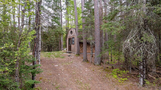 2260 Goldmine Rd, Ely, MN 55731 - view of front of home featuring an outbuilding and a view of trees