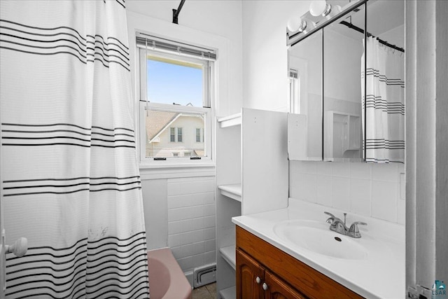 4308 W 8th St, Duluth, MN 55807 - bathroom featuring vanity, baseboard heating, tasteful backsplash, and shower / bath combination with curtain