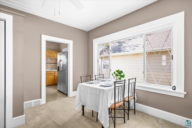 4308 W 8th St, Duluth, MN 55807 - dining space featuring light carpet, baseboards, and a ceiling fan