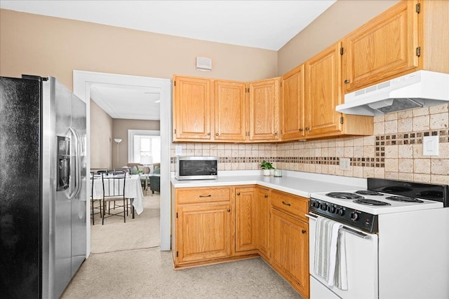 4308 W 8th St, Duluth, MN 55807 - kitchen with appliances with stainless steel finishes, under cabinet range hood, light countertops, and decorative backsplash