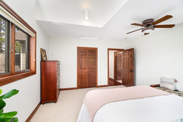 596 W Wabasha St, Duluth, MN 55803 - bedroom with light carpet, baseboards, and ceiling fan