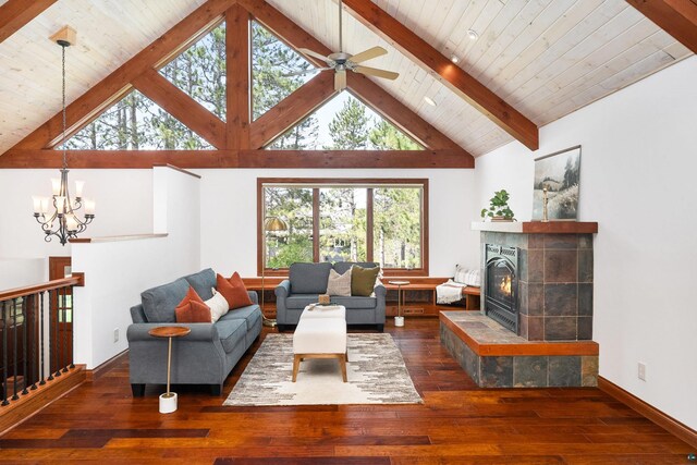 596 W Wabasha St, Duluth, MN 55803 - living area with hardwood / wood-style flooring, a chandelier, a tiled fireplace, high vaulted ceiling, and baseboards