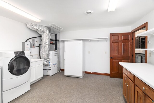 596 W Wabasha St, Duluth, MN 55803 - laundry room with cabinet space, washer / clothes dryer, light colored carpet, and heating unit