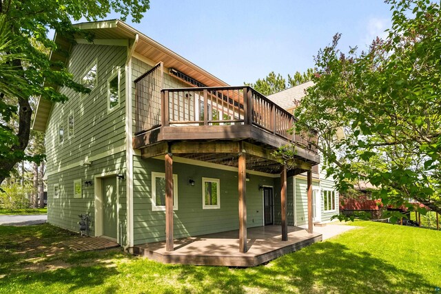 596 W Wabasha St, Duluth, MN 55803 - rear view of house with a deck and a yard