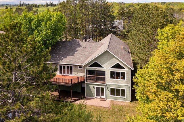 596 W Wabasha St, Duluth, MN 55803 - back of property featuring a patio, roof with shingles, and a wooden deck