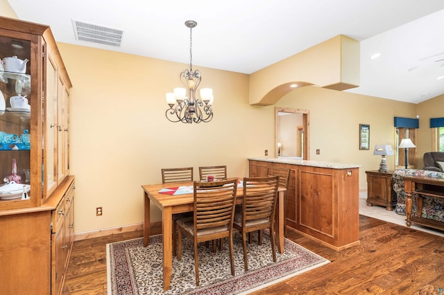 5036 Silver Leaf St, Hermantown, MN 55811 - dining area featuring dark wood-style floors, a chandelier, and baseboards