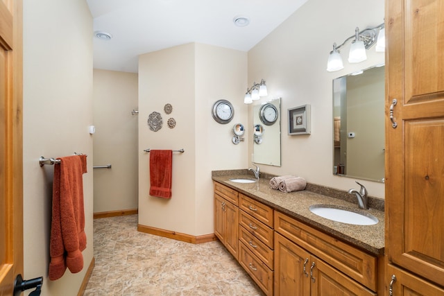 5036 Silver Leaf St, Hermantown, MN 55811 - bathroom featuring double vanity and baseboards