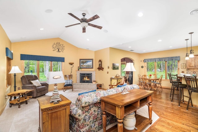 5036 Silver Leaf St, Hermantown, MN 55811 - living area with ceiling fan, light wood finished floors, a glass covered fireplace, vaulted ceiling, and recessed lighting