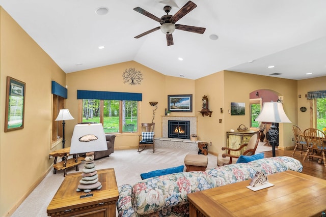 5036 Silver Leaf St, Hermantown, MN 55811 - living room featuring a ceiling fan, lofted ceiling, baseboards, a tile fireplace, and recessed lighting