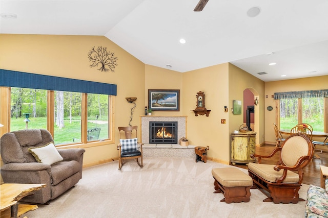 5036 Silver Leaf St, Hermantown, MN 55811 - living room with arched walkways, baseboards, lofted ceiling, a tile fireplace, and recessed lighting