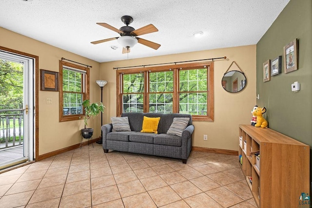 13107 W 9th St, Duluth, MN 55808 - living room with baseboards, a ceiling fan, light tile patterned flooring, and a textured ceiling