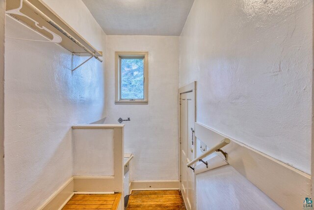4191 Kerr Location, Hibbing, MN 55746 - stairs with baseboards and wood finished floors