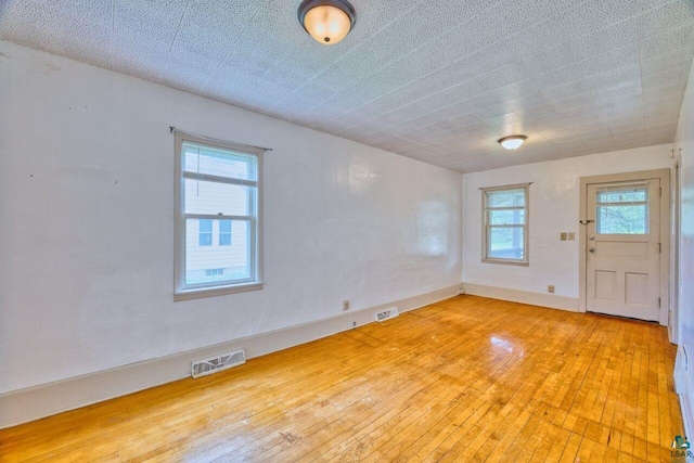 4191 Kerr Location, Hibbing, MN 55746 - unfurnished room with hardwood / wood-style flooring