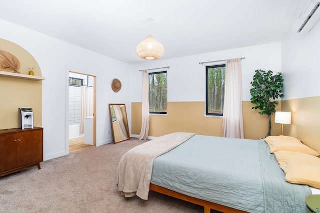 2413 Lismore Rd, Duluth, MN 55804 - bedroom with a wall mounted AC, multiple windows, carpet flooring, and baseboards