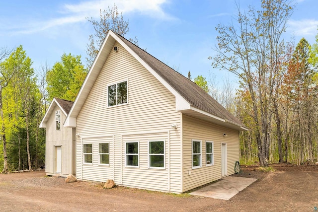 2413 Lismore Rd, Duluth, MN 55804 - view of side of property featuring a shingled roof