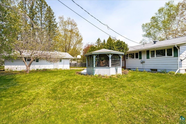 2715 Triggs Ave, Duluth, MN 55811 - view of green lawn with a gazebo and a sunroom