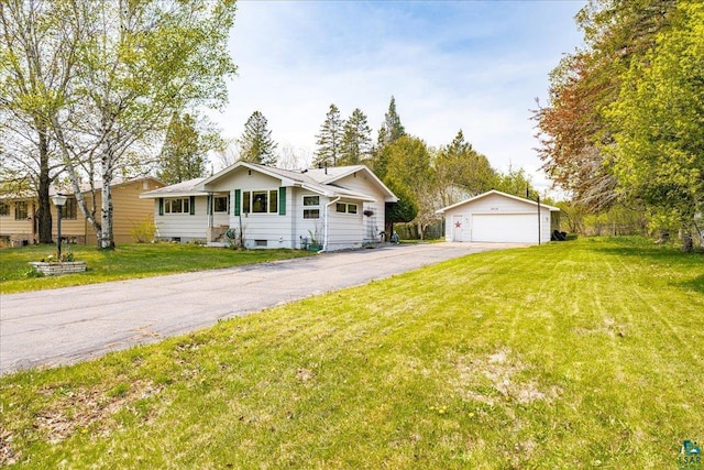 2715 Triggs Ave, Duluth, MN 55811 - ranch-style home with an outdoor structure, a detached garage, and a front yard