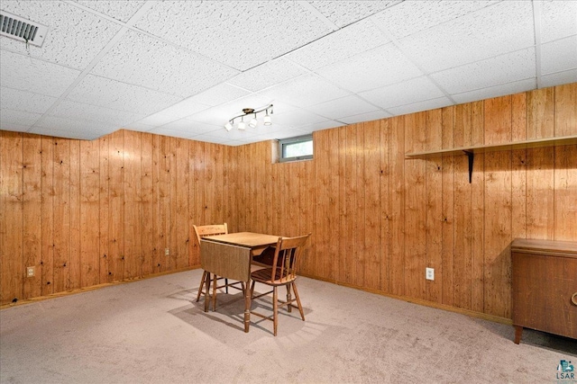 2715 Triggs Ave, Duluth, MN 55811 - carpeted dining room featuring wood walls