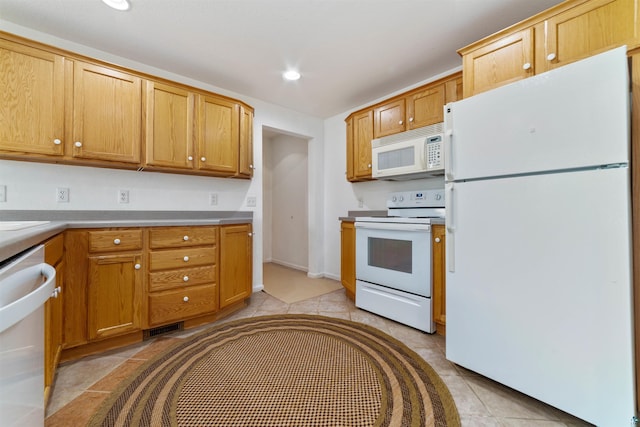 601 N 22nd Ave W, Duluth, MN 55806 - kitchen with white appliances, recessed lighting, light tile patterned floors, and light countertops