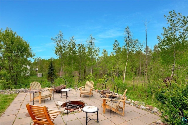 1505 Coachlight Crk, Proctor, MN 55810 - view of patio / terrace featuring an outdoor fire pit