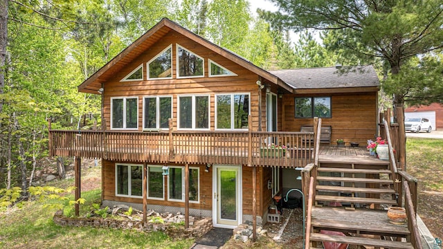 3984 Stocking Point Dr, Ely, MN 55731 - back of property with a wooden deck and a shingled roof