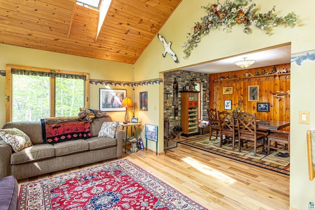 3984 Stocking Point Dr, Ely, MN 55731 - living room with wood finished floors, high vaulted ceiling, wooden walls, a skylight, and wooden ceiling