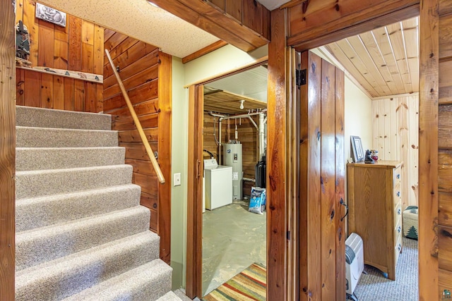 3984 Stocking Point Dr, Ely, MN 55731 - staircase with washer / dryer, wood walls, electric water heater, and concrete floors
