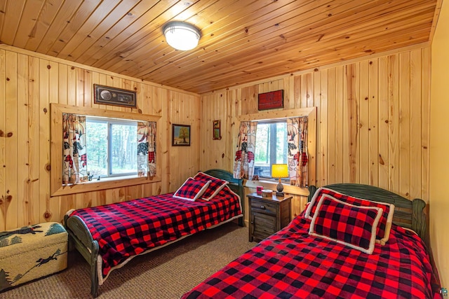 3984 Stocking Point Dr, Ely, MN 55731 - bedroom with wooden walls, multiple windows, wood ceiling, and carpet flooring