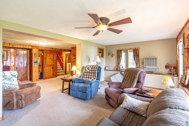 3984 Stocking Point Dr, Ely, MN 55731 - living room featuring ceiling fan, heating unit, stairway, and carpet