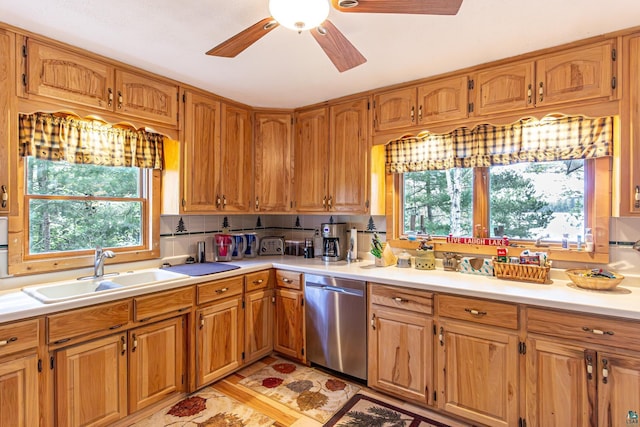 3984 Stocking Point Dr, Ely, MN 55731 - kitchen with dishwasher, a sink, ceiling fan, light countertops, and brown cabinets