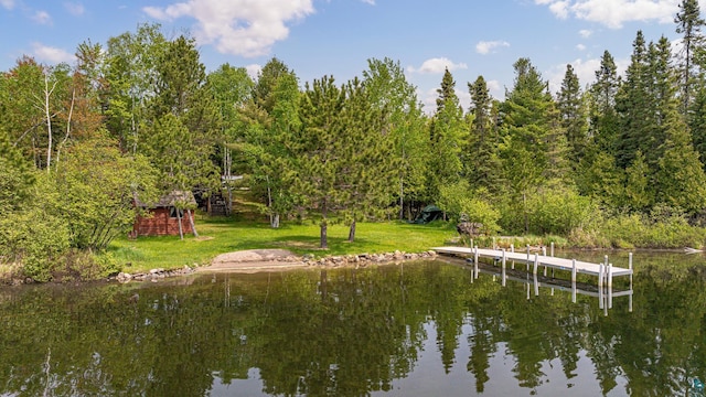 3984 Stocking Point Dr, Ely, MN 55731 - dock area with a water view, a wooded view, and a lawn