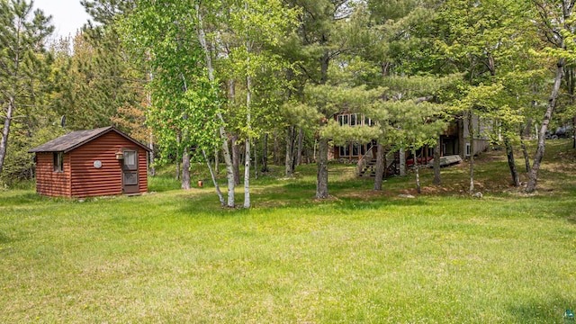 3984 Stocking Point Dr, Ely, MN 55731 - view of grassy yard featuring an outbuilding and stairs
