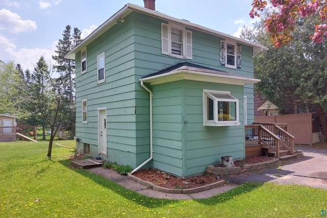 18 E Wabasha St, Duluth, MN 55803 - view of side of home featuring a chimney