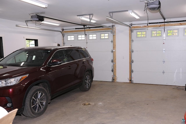 5004 W Rd, Moose Lake, MN 55767 - garage featuring a garage door opener