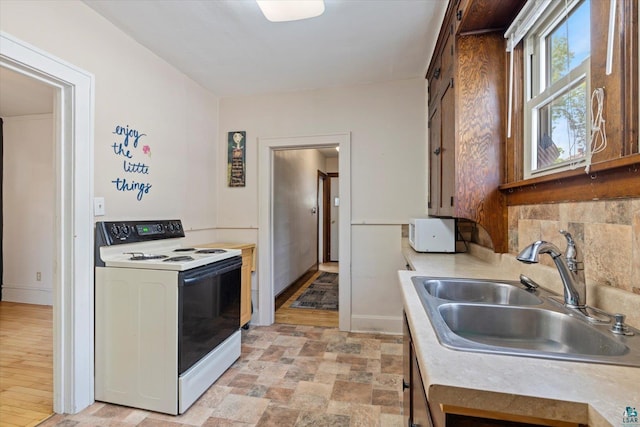 620 Hayes St, Eveleth, MN 55734 - kitchen with white appliances, a sink, and light countertops