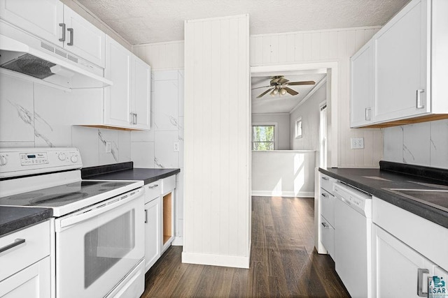 627 E Skyline Pkwy, Duluth, MN 55805 - kitchen featuring white appliances, under cabinet range hood, dark wood-style flooring, dark countertops, and crown molding