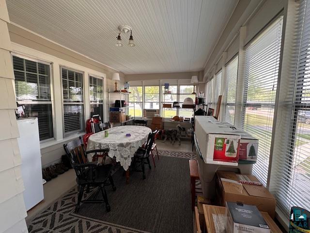 1601 W 4th Ave, International Falls, MN 56649 - sunroom / solarium featuring outdoor dining area and wooden ceiling