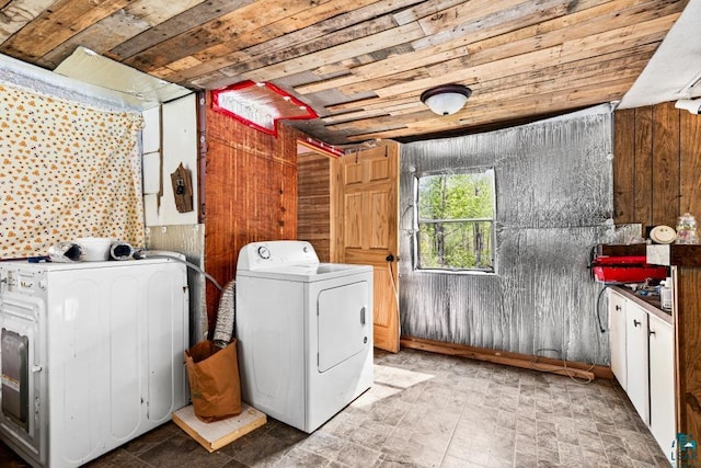 4605 Mccomber Rd, Duluth, MN 55803 - washroom with washer and clothes dryer, wooden ceiling, wooden walls, and cabinet space