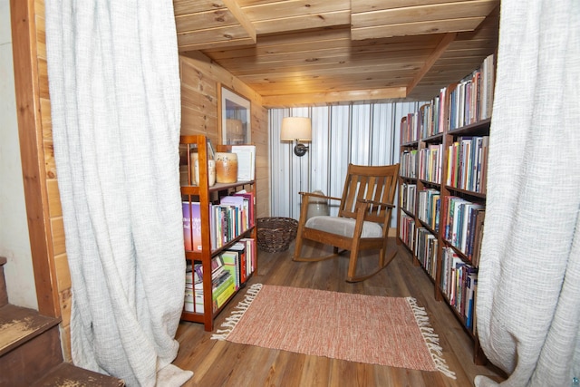 72 Sled Dog Trl, Hovland, MN 55604 - sitting room featuring wood ceiling, wood finished floors, and wall of books