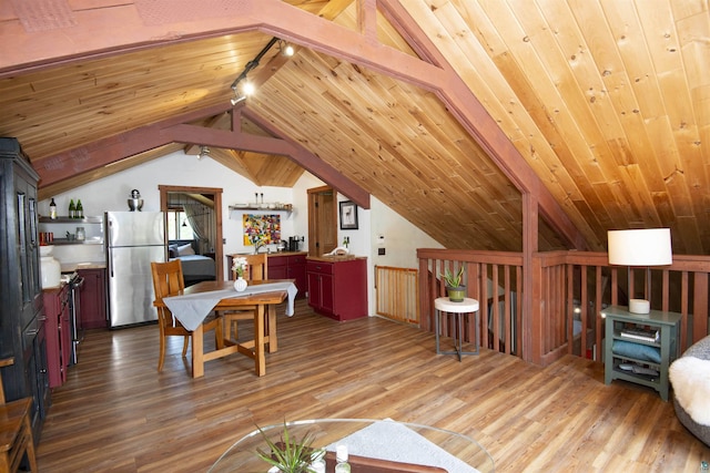 72 Sled Dog Trl, Hovland, MN 55604 - living room featuring vaulted ceiling, rail lighting, wood finished floors, and wooden ceiling