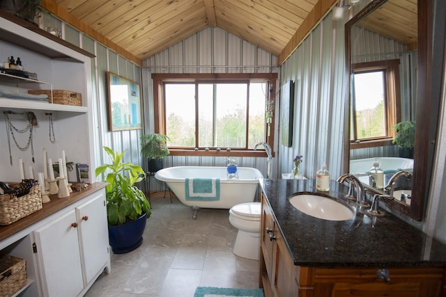 72 Sled Dog Trl, Hovland, MN 55604 - bathroom featuring vaulted ceiling, wooden ceiling, a freestanding bath, vanity, and toilet