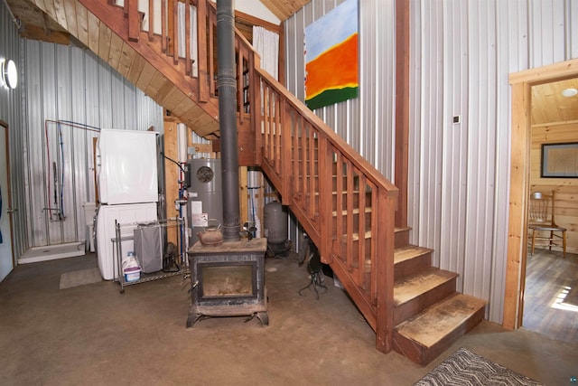 72 Sled Dog Trl, Hovland, MN 55604 - stairway featuring a wood stove, water heater, and wooden walls