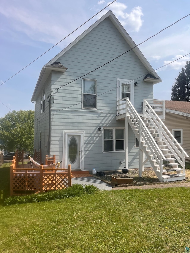 2213 W 10th St, Duluth, MN 55806 - rear view of house with a yard, stairs, and a wooden deck