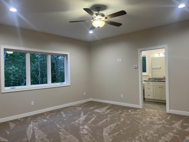 5036 W Arrowhead Rd, Hermantown, MN 55811 - carpeted spare room with a ceiling fan and recessed lighting