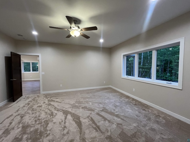 5036 W Arrowhead Rd, Hermantown, MN 55811 - empty room with a ceiling fan and carpet floors