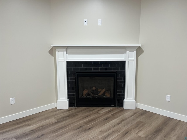 5036 W Arrowhead Rd, Hermantown, MN 55811 - detailed view of a tiled fireplace and wood finished floors