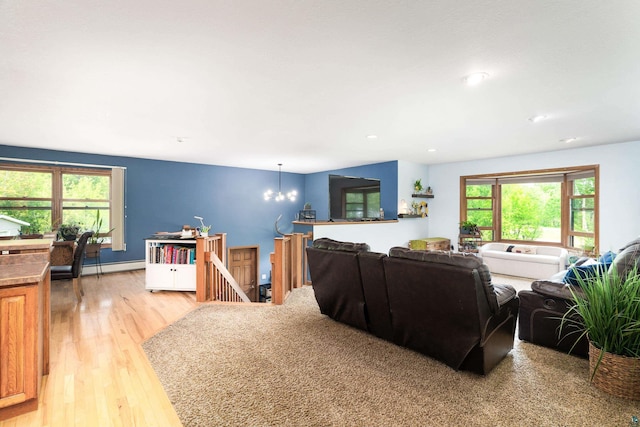 4409 Cedarway Rd, Duluth, MN 55810 - living area with baseboard heating, light wood-style flooring, a chandelier, and recessed lighting