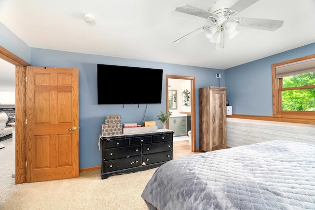 4409 Cedarway Rd, Duluth, MN 55810 - carpeted bedroom with baseboards, a ceiling fan, and connected bathroom