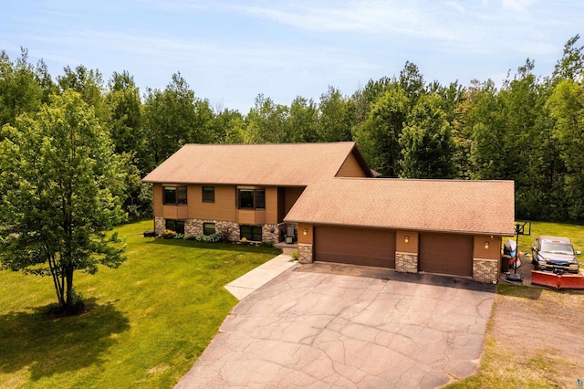 4409 Cedarway Rd, Duluth, MN 55810 - view of front of house with stone siding, a garage, asphalt driveway, and a front yard
