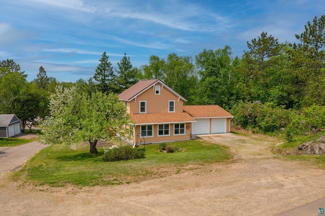 1 W Railroad St, Ely, MN 55731 - view of front facade with driveway and a front yard